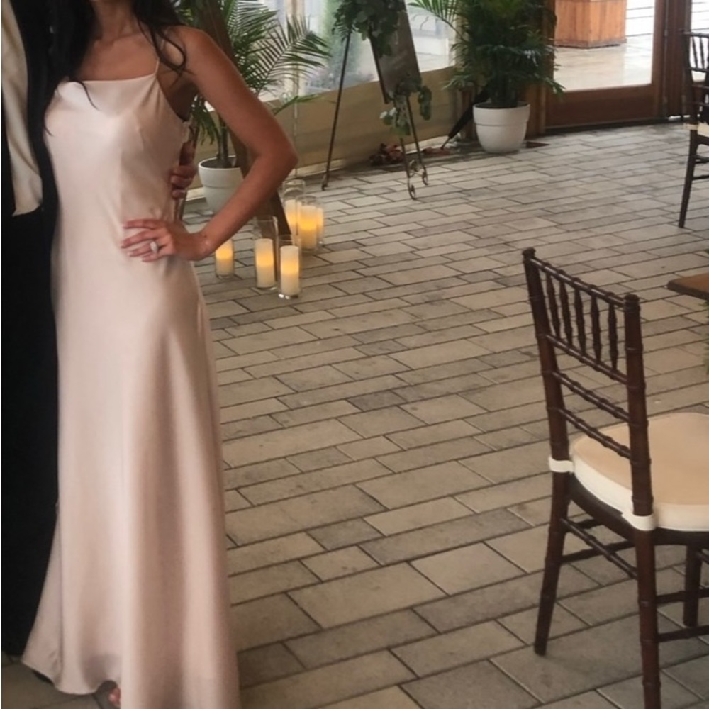 Waters bridesmaid dress color is an ivory/tan/ beige color